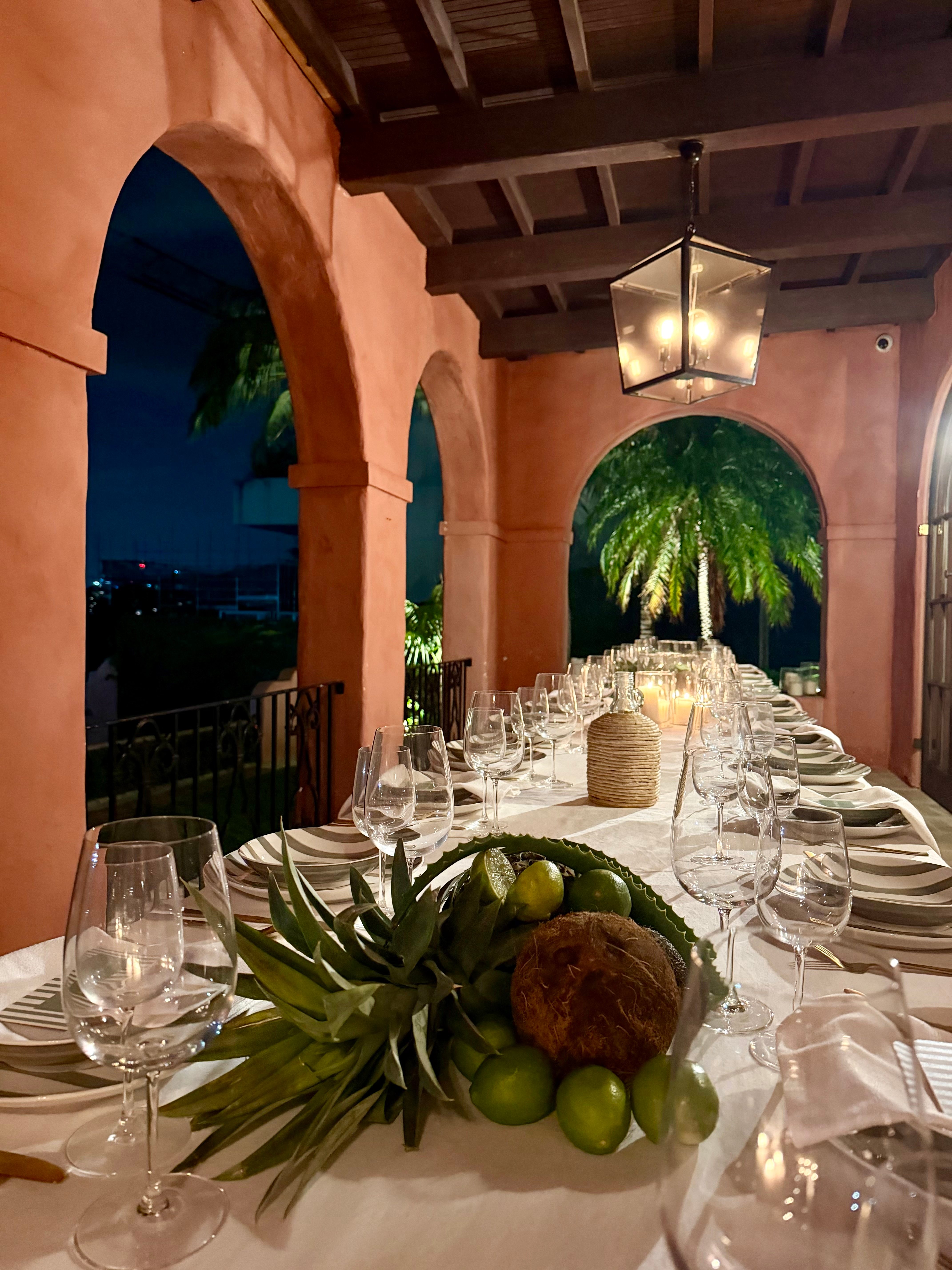 Long banquet table with tropical florals at Villa Biscaya
